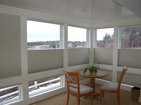 A breakfast nook with large windows